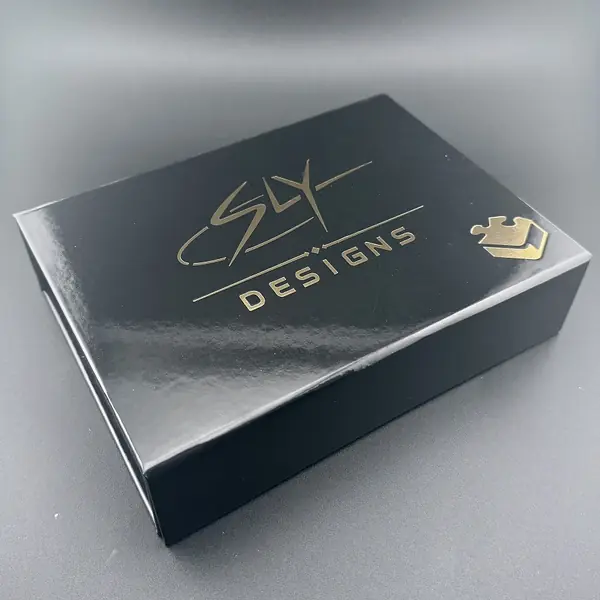 NEUTRINO black presentation box with the gold-foil Sly Designs logo