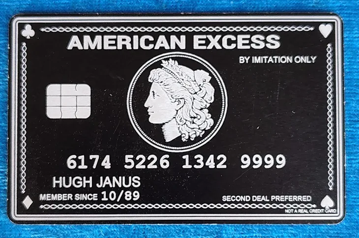 American Excess engraved black metal novelty credit card in the name of Hugh Janus